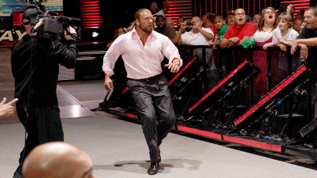 Triple H vs. Брок Лесна photo